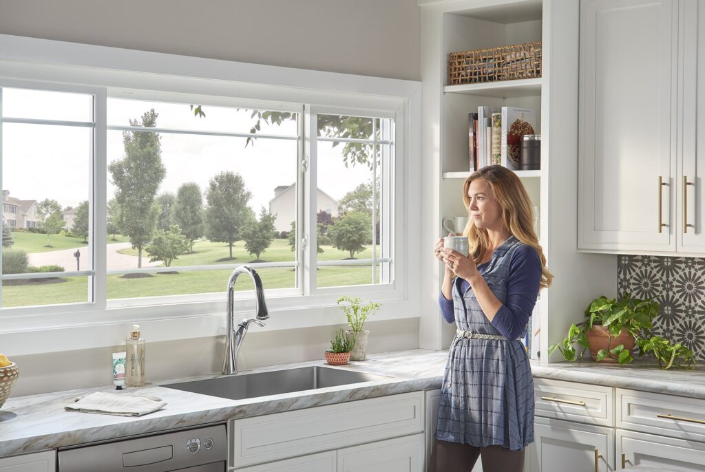 woman looking out window