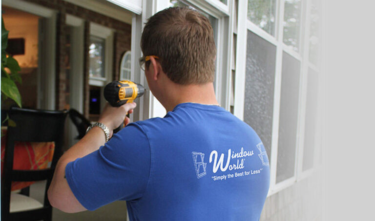 window world employee installing windows