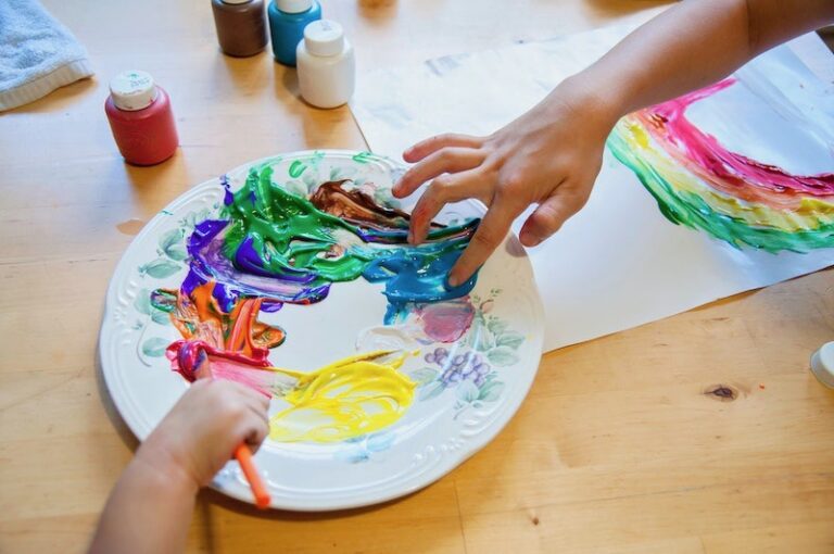 kids using finger paint